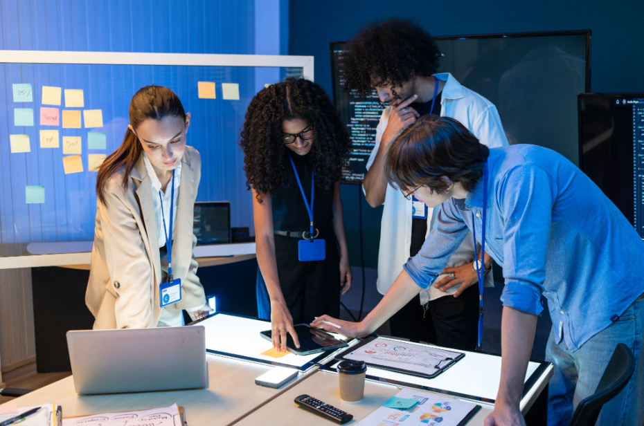 Science and digital communications agency team analyzing scientific data and digital insights on illuminated worktables