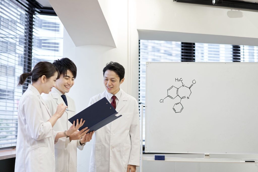 Medical and research professionals reviewing product data before a pharmaceutical launch