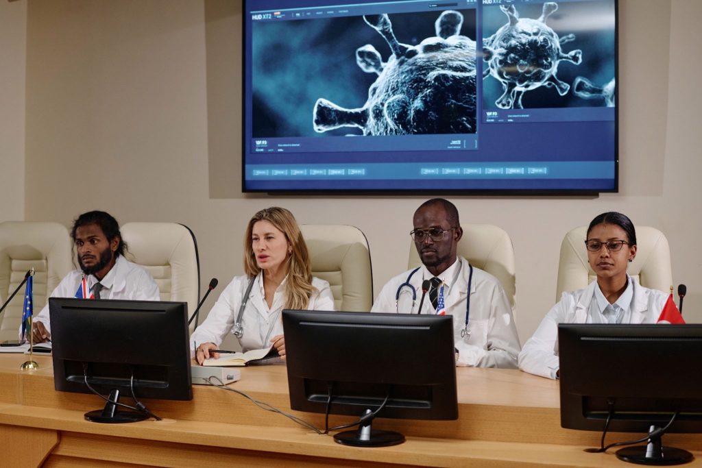 Medical experts presenting scientific findings during a scientific advisory board meeting
