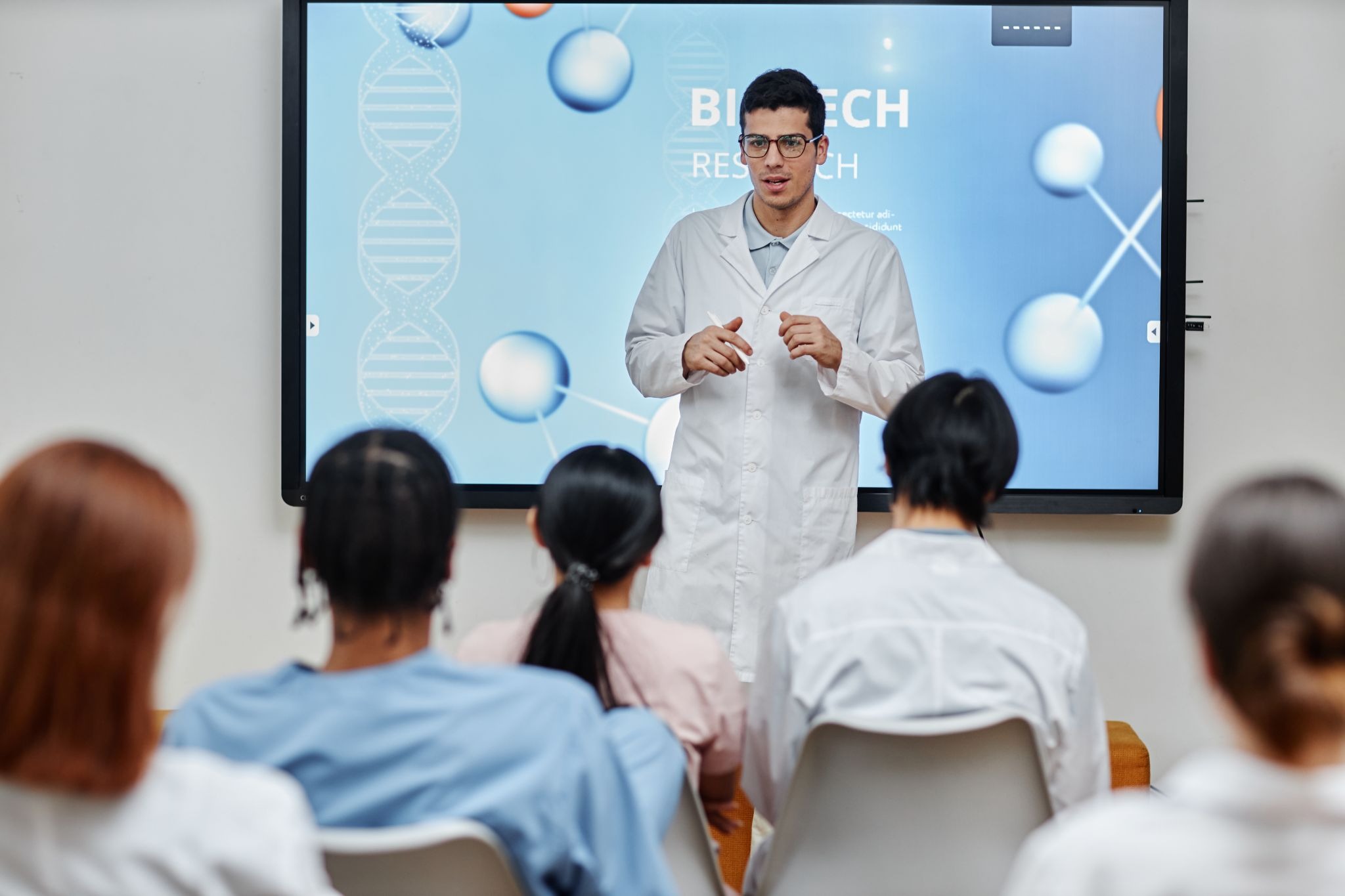 Young scientist presenting clear, consistent scientific terminology