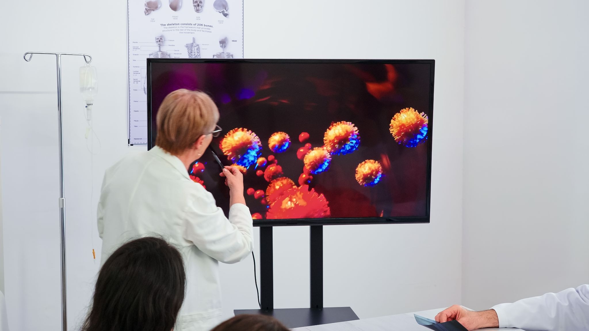 Doctor using Visual Nomenclature® to present and explain coronavirus concepts on a digital screen